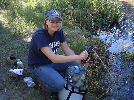 Sarah Sterilizing the Carboy with Filtered River Water